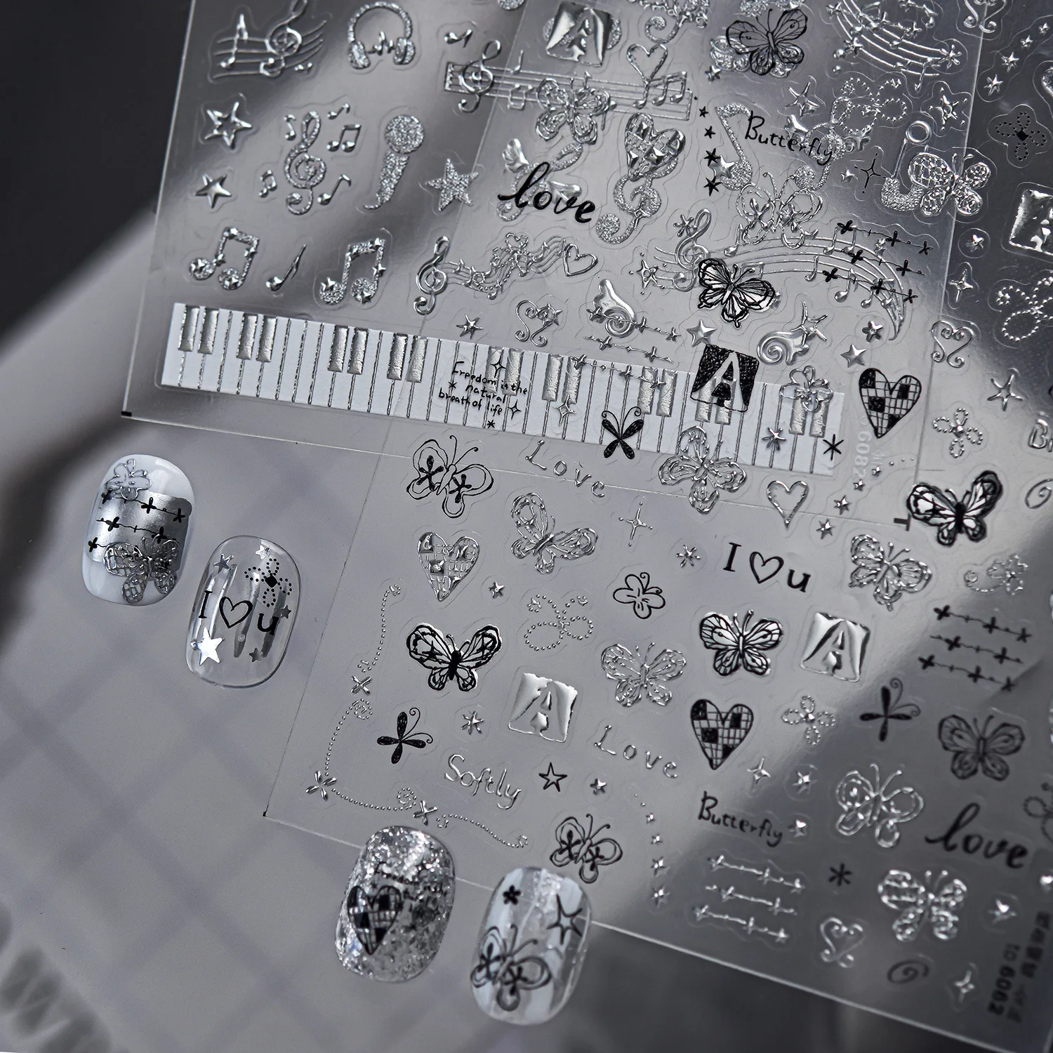 ملصقات أظافر موسيقية فضية بتصم - مراجعة Musical Instrument Images وسعره