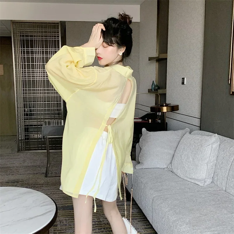 Koszule damskie cienkie letnie odporne na słońce wiązanie z tyłu elegancki design przezroczyste seksowne damskie pojedyncze piersi Casual Holiday Baggy Fit Blusas