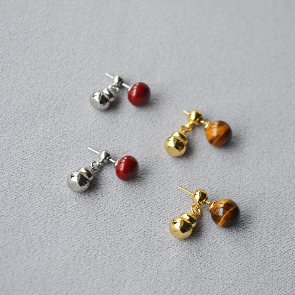 

Изящные серьги-гвоздики в китайском стиле с отстегивающимся элементом в виде тыквы и камнем тигровый глаз, серебро 925 пробы, легкие роскошные украшения для женщин