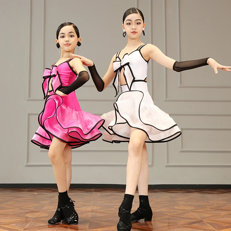 2025 Nuove Ragazze Costume di Ballo Latino Rosa Bianco Arco Top Gonna Performance Set Bambini Cha Cha Rumba Concorso di Ballo Vestito DNV22280
