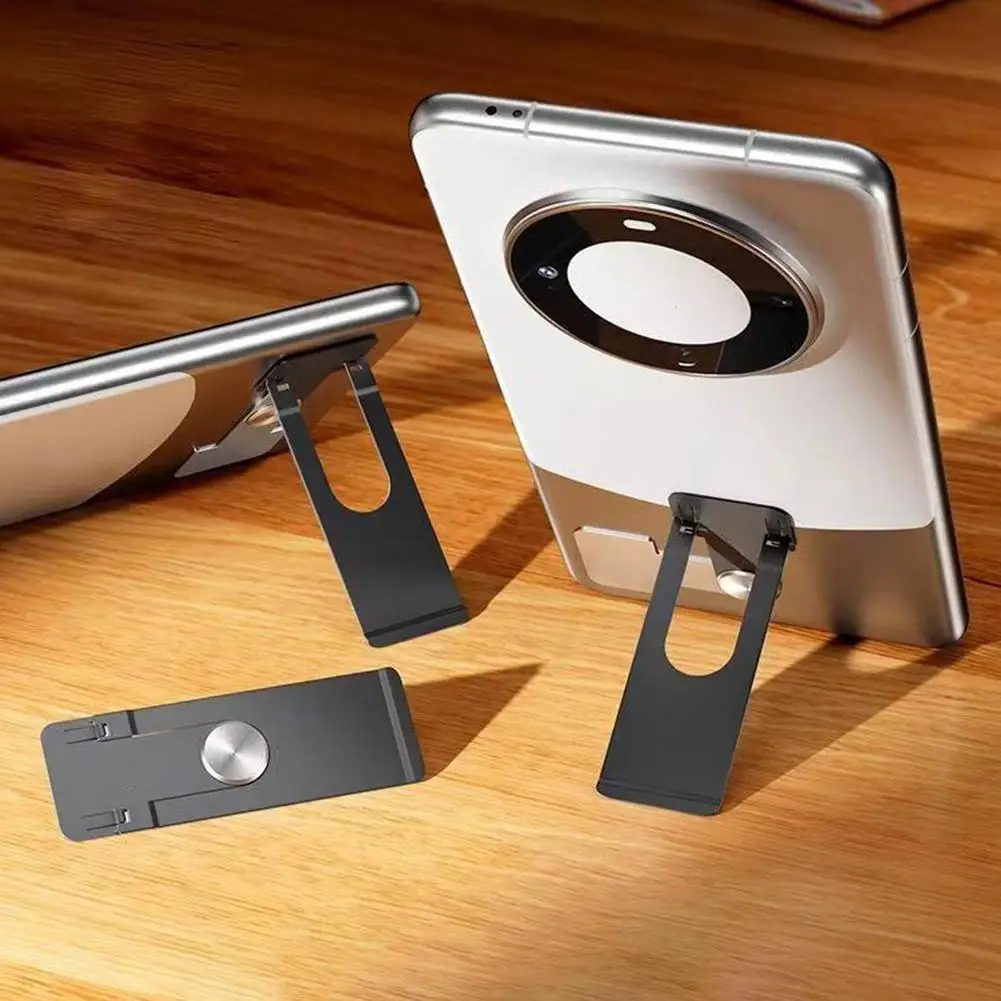 مسند عالمي صغير قابل للطي للهاتف المحمول ذاتي اللصق متماثل حامل لوحي لهاتف IPhone IPad