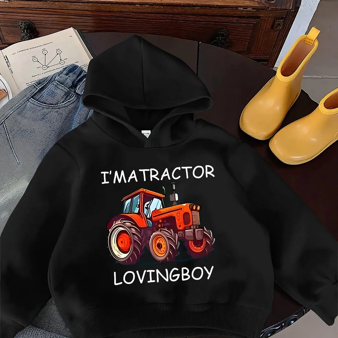The Cartoon Tractor Design Is Fun and Adds a Touch of Sporty Style; a Fashionable Hooded Sweatshirt for Autumn and Winter.