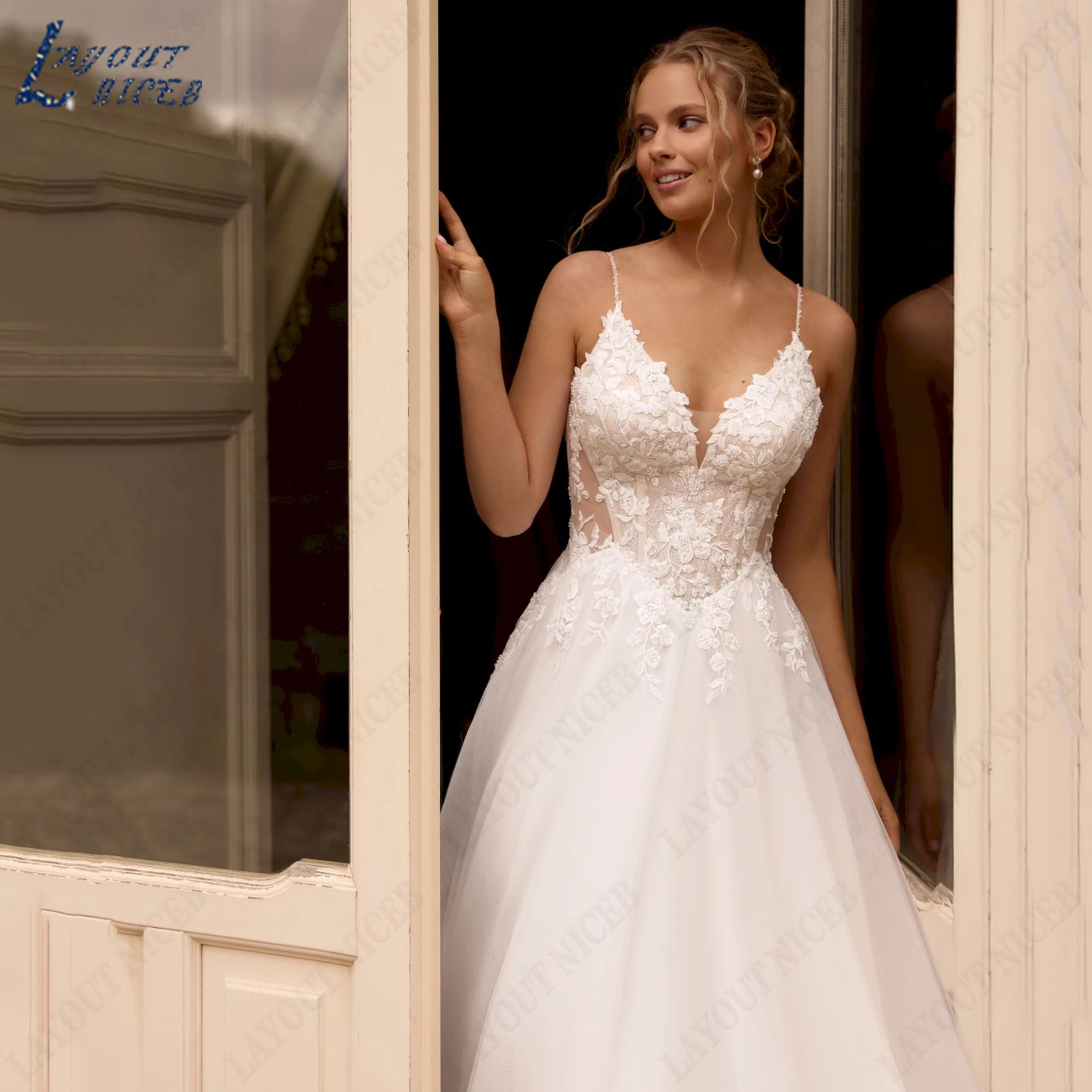 LAYOUT NICEB Customied Spaghetti Strap Deep V Wedding Dress Sheer Low Open Back Floral Applique Flowy Tulle A-line Bridal Gown