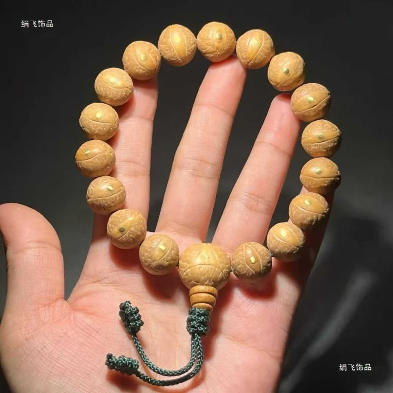 Natural round Nepalese red and yellow Phoenic-eye Bodhi beads inlaid with copper nails, original single-strand hand-held Buddhis