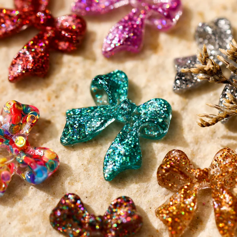 50 stücke Glitter Gemischte Farbe Bogen Nagel Charms 3D Kawaii Glänzende Pailletten Bögen Nagel Dekoration DIY Design Nagel Zubehör 11*12mm