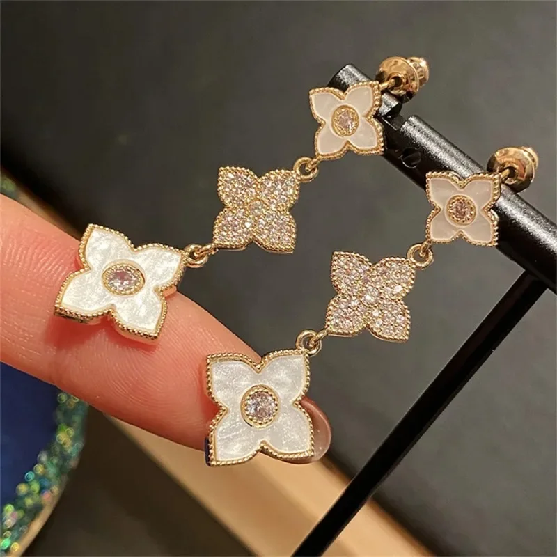 

Fashion four-leaf clover drop earrings for women Korean gold color bling zircon long earrings party jewelry anniversary gifts