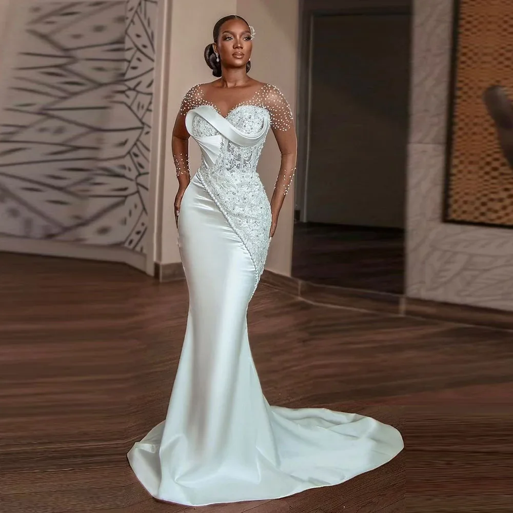 

Elegant White Mermaid Wedding Dresses Pearls Beading Sheer Long Sleeves Floor Length Bridal Gowns African Sweep Train Gowns