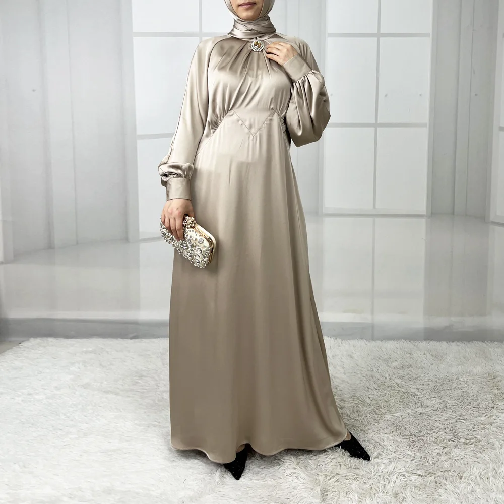 New style women's fashionable long satin dress with lantern sleeves. It is a Muslim robe from Dubai, Turkey and Arab regions.