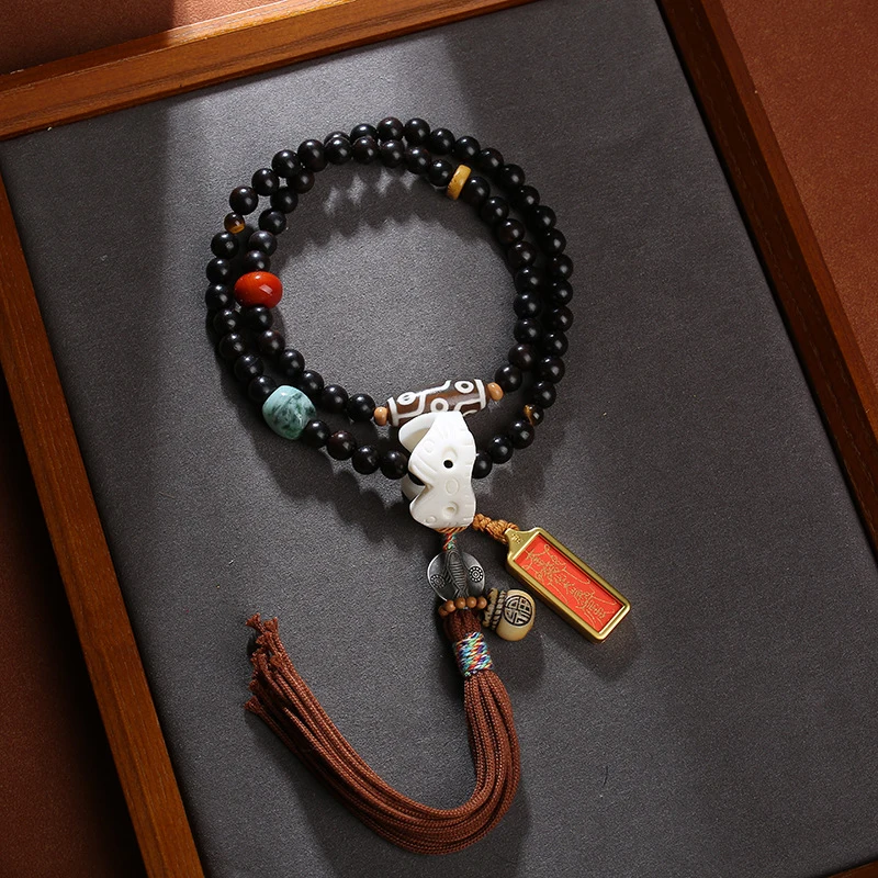 

Tai Sui thangka pendant made of sandalwood 108 beads, paired with a nine-eyed dzi bead and jade scale cord, et