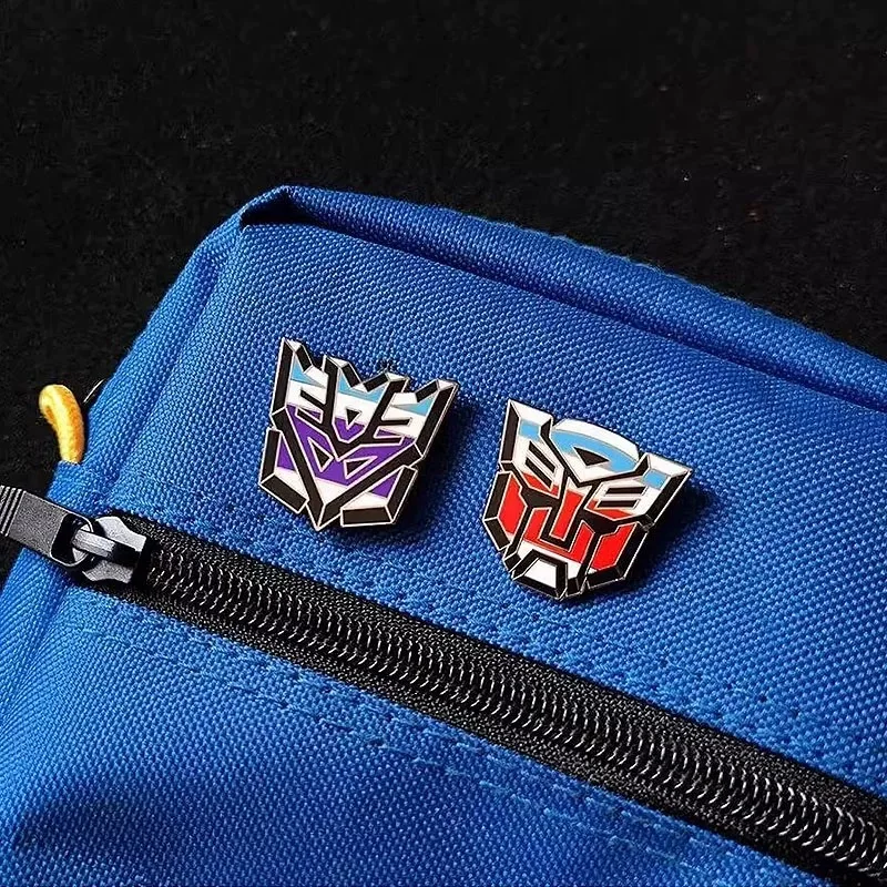 Hasbro Transformers Lapel Pins การ์ตูนตัวอักษรเคลือบ Pin น่ารักเข็มกลัดโลหะ Lapel ป้ายการ์ตูนตลกเครื่องประดับของขวัญ