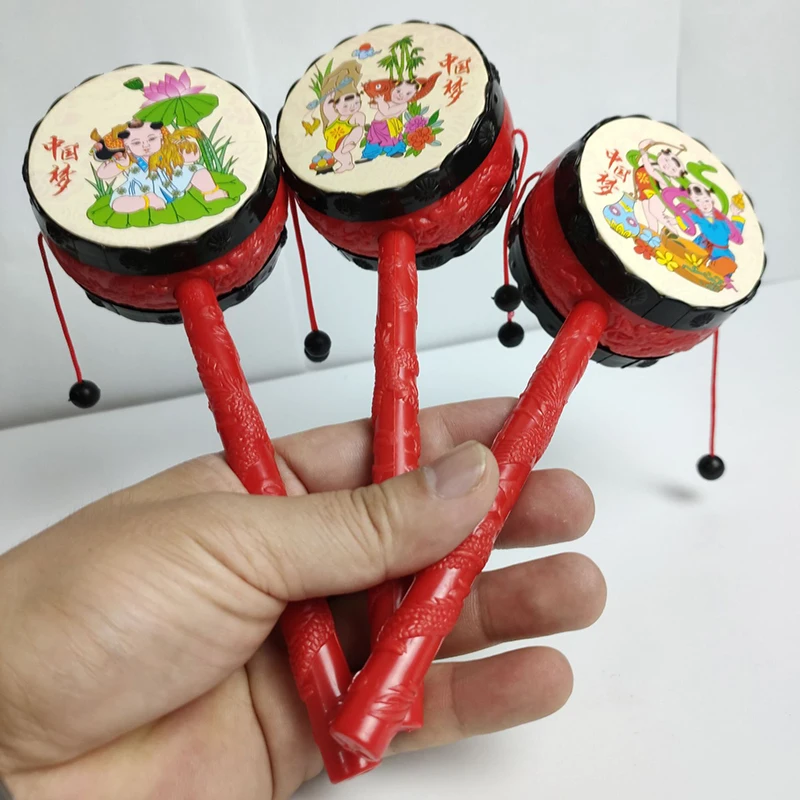 Giocattoli nostalgici per bambini bambola di capodanno in stile cinese sonaglio di buon auspicio divertente piccolo tamburo sonaglio giocattolo lenitivo per bambini regalo di compleanno