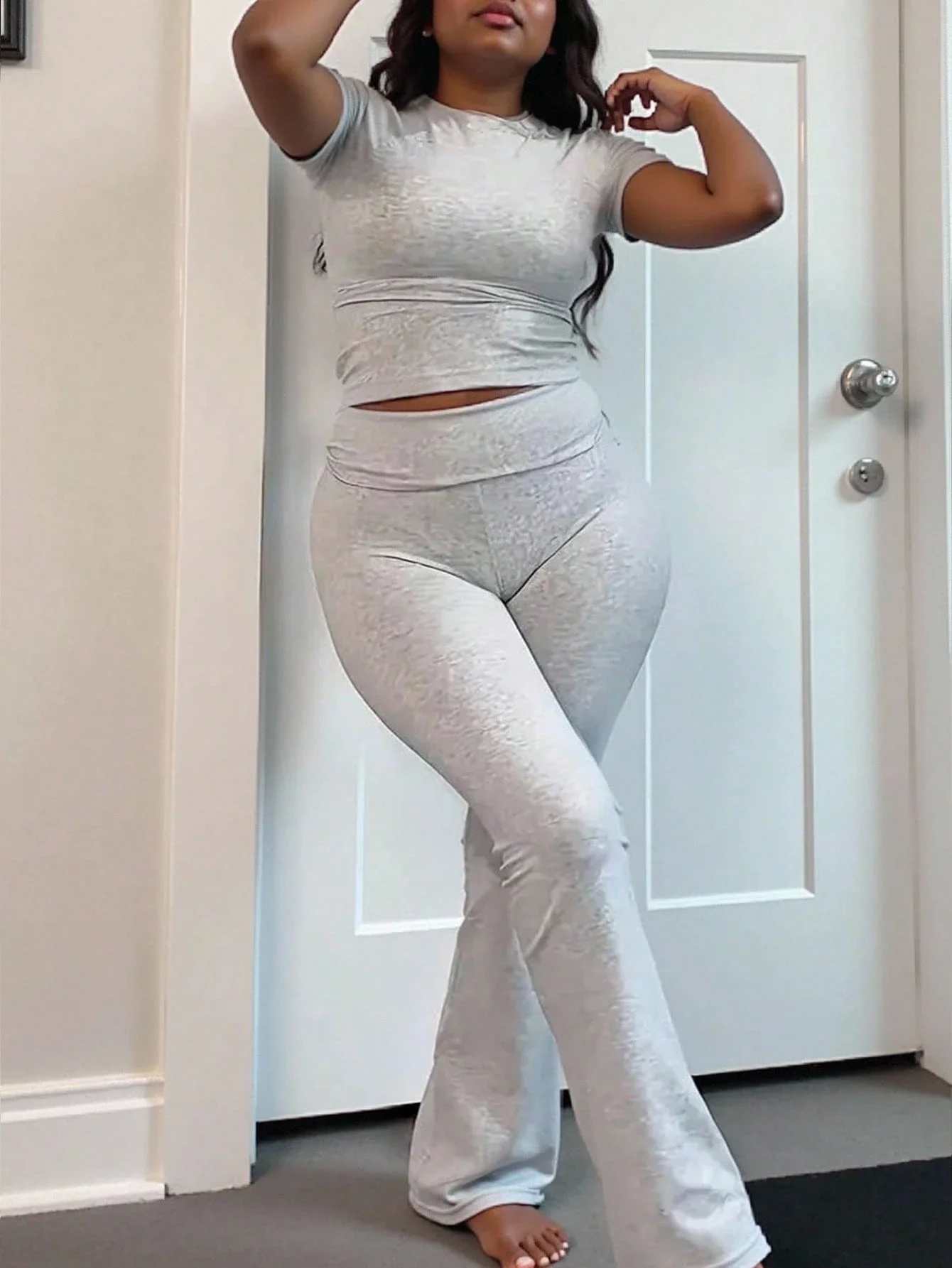 

Plus Size Women Solid Color Round Neck Short Sleeve T-Shirt And Flare Pants Casual 2 Piece Set