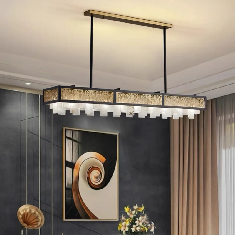 

Transitional Brushed Gold and Marble Chandelier. This dimmable lamp masterfully blends classic with a versatile lustre