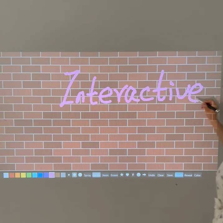 Interactive projection graffiti installation; digital interactive graffiti wall game for preschool education.