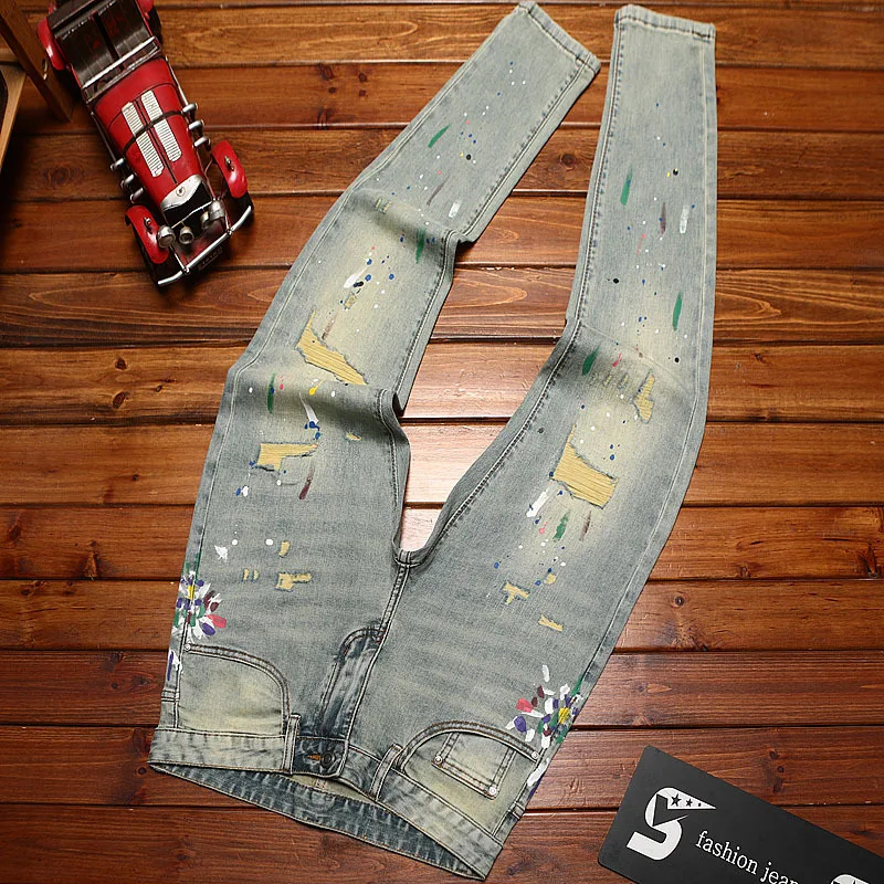 

2025 new retro distressed patch jeans for men with slim fit and small feet, trendy paint printed street fashion denim pants