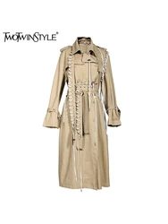 TWOTWINSTYLE Solid Patchwork Lace Up Asymmetrical Trench For Women Lapel Long Sleeve Spliced Button Street Style Coats Female