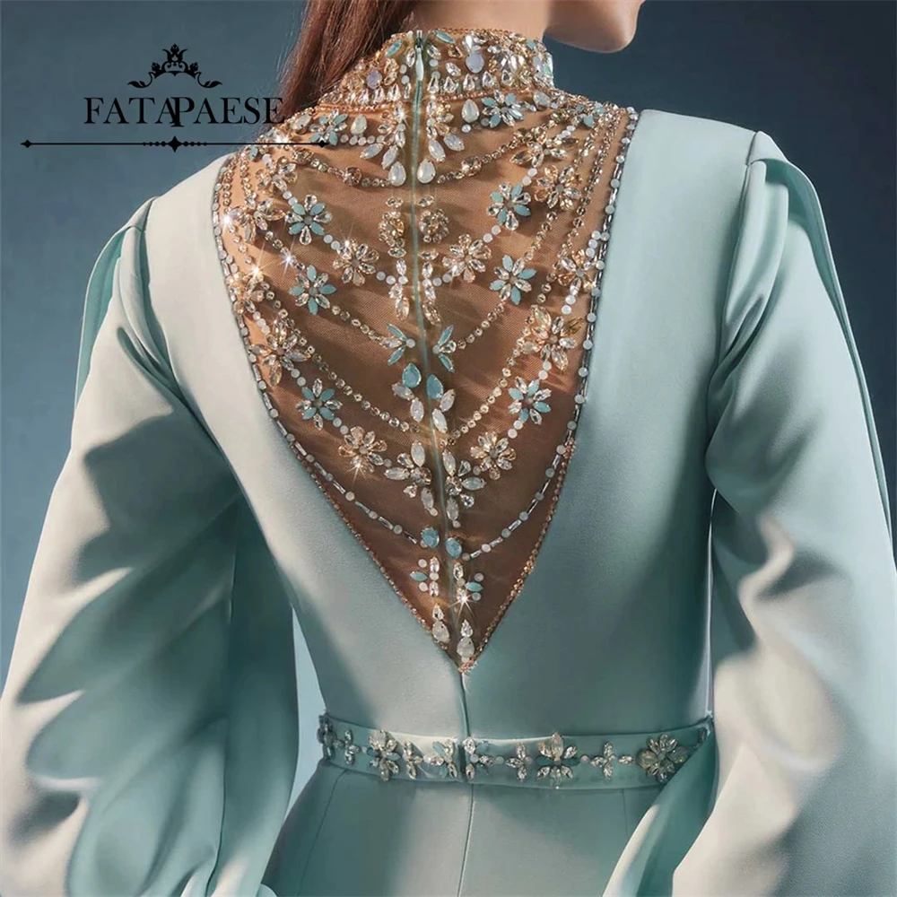 فساتين سهرة فاخرة من FATAPAESE بكريستال ورقبة عالية باللون الأزرق الفاتح للحفلات الراقصة بأكمام طويلة وحفلات الزفاف