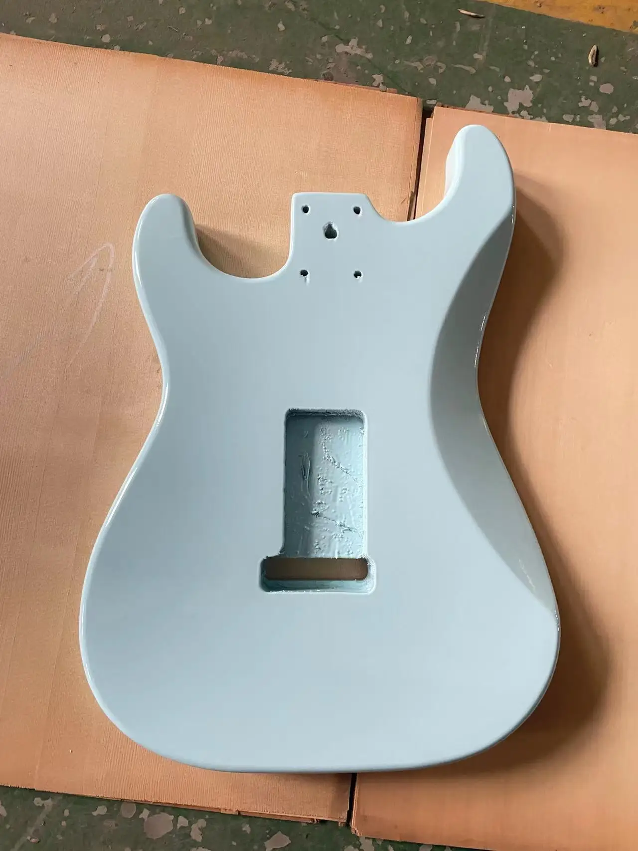 The blue glossy guitar panel is an ST style electric guitar with a half empty heart barrel DIY guitar. The colored guitar body i