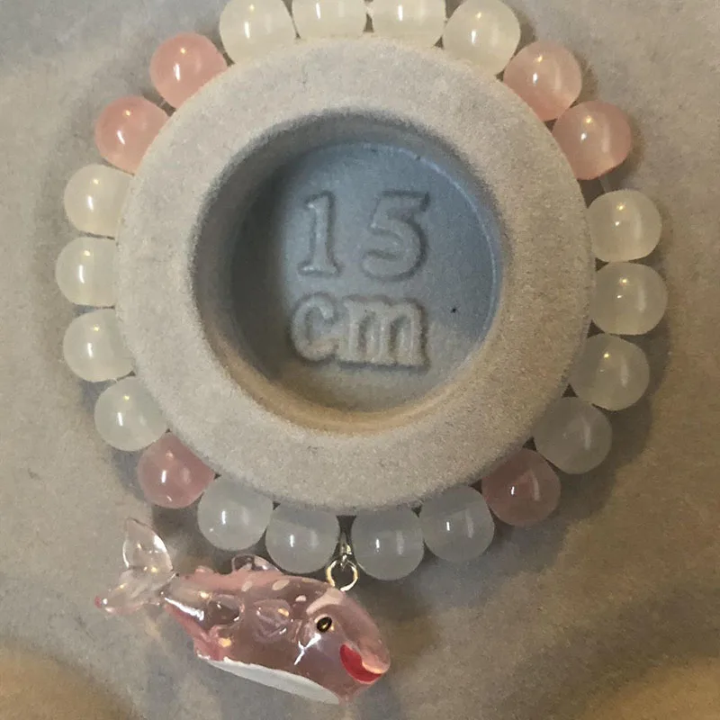 White and pink whale bead bracelet Wont break Homemade