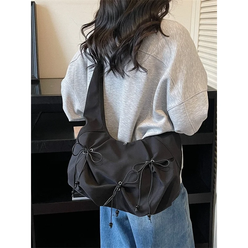 

Korean-style sweet bow nylon bag for women, large-capacity daily commuter shoulder and crossbody bag, versatile casual bag