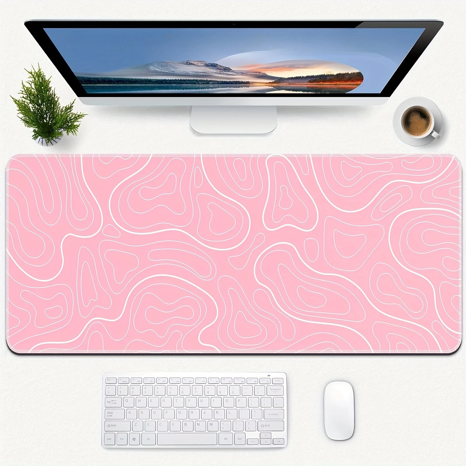 

The large gaming mouse pad with anti-slip rubber is suitable for both gaming and office use. It features a pink terrain pattern