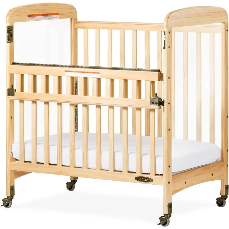 Wooden compact portable crib with 2 easy to roll locking wheels, durable wood construction