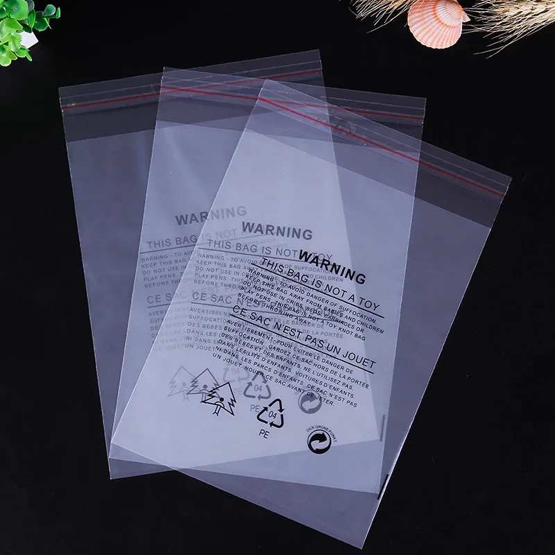 INPLUSTOP 100Pcs Poly Bag with English Warning Words Self-adhesive Transparent Plastic Pack Bag Clothes Storage Reusable Pouches