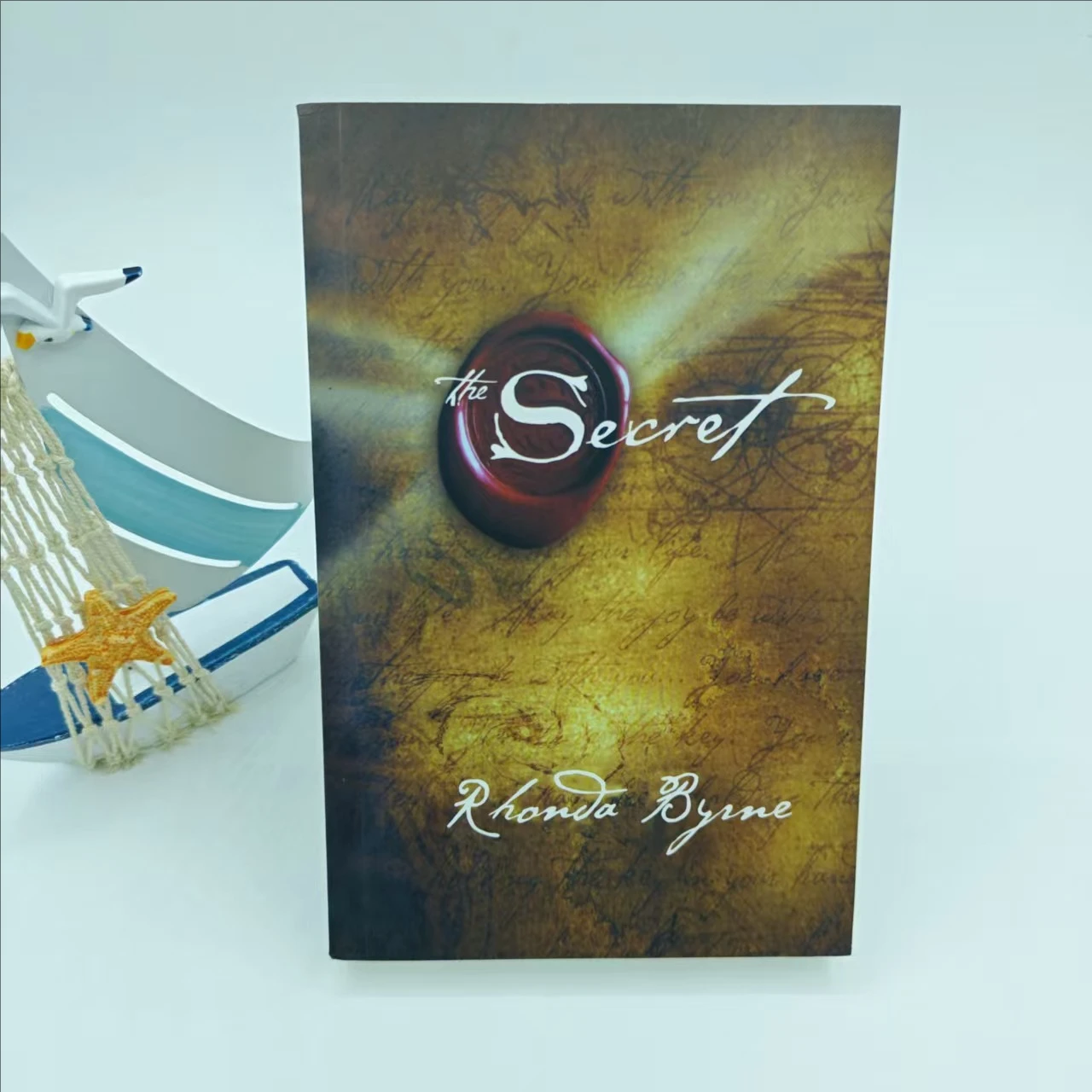 1 book: The Secret by Rhoda Bourne in English paperback. philosophy books english books