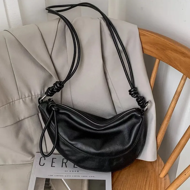 Koreańska świeża mniejszościowa wykwintna skóra tekstura włóczęga w stylu Vintage Half Moon sznurowane torby Crossbody z zamkiem błyskawicznym