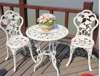 The garden table. Cast aluminium table and chair three pieces