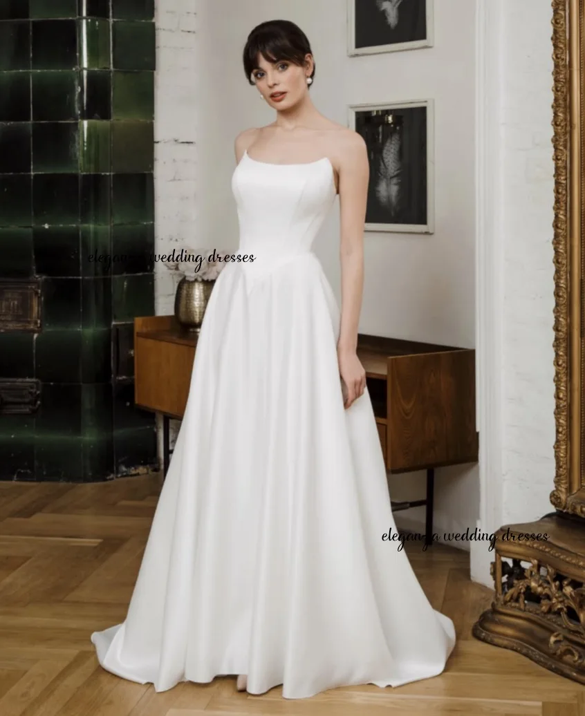 فستان زفاف أبيض رائع مخصص، فستان على شكل حرف A من الساتان بدون أكمام بدون حمالات، حفلة نسائية فيستدو دي نوفيا 2025