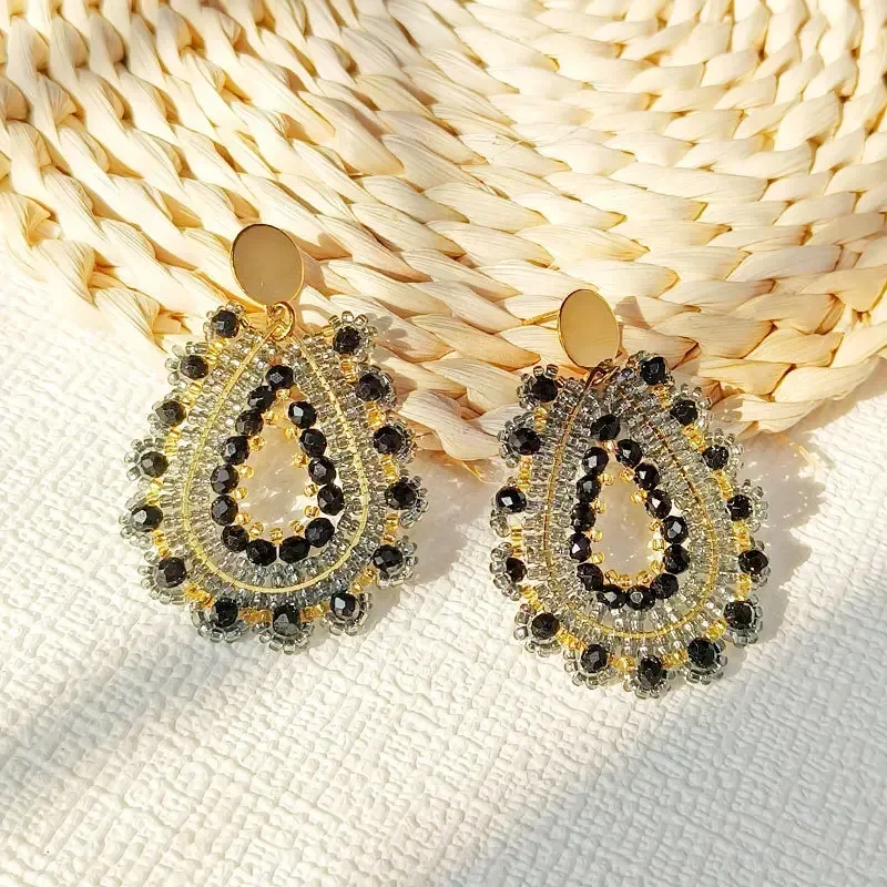 Beaded earrings Black. Originality Water drop Crystal Hollow out Flowers Hand knitting Bohemia Tide Simple Rice bead earrings