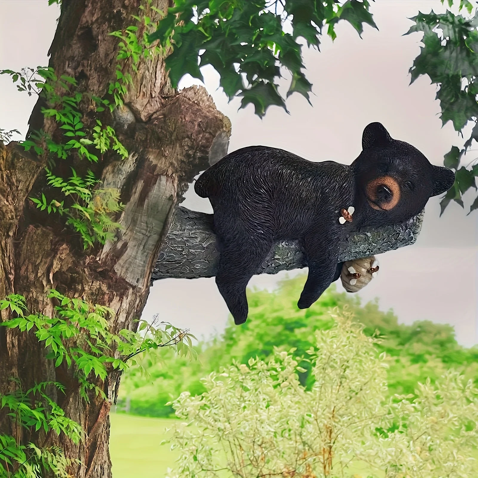 Resin Cute Sleeping Black Bear Hanging on Tree Branch with Honeycomb Statue for Outdoor Garden Yard Trunk Decor Ornament