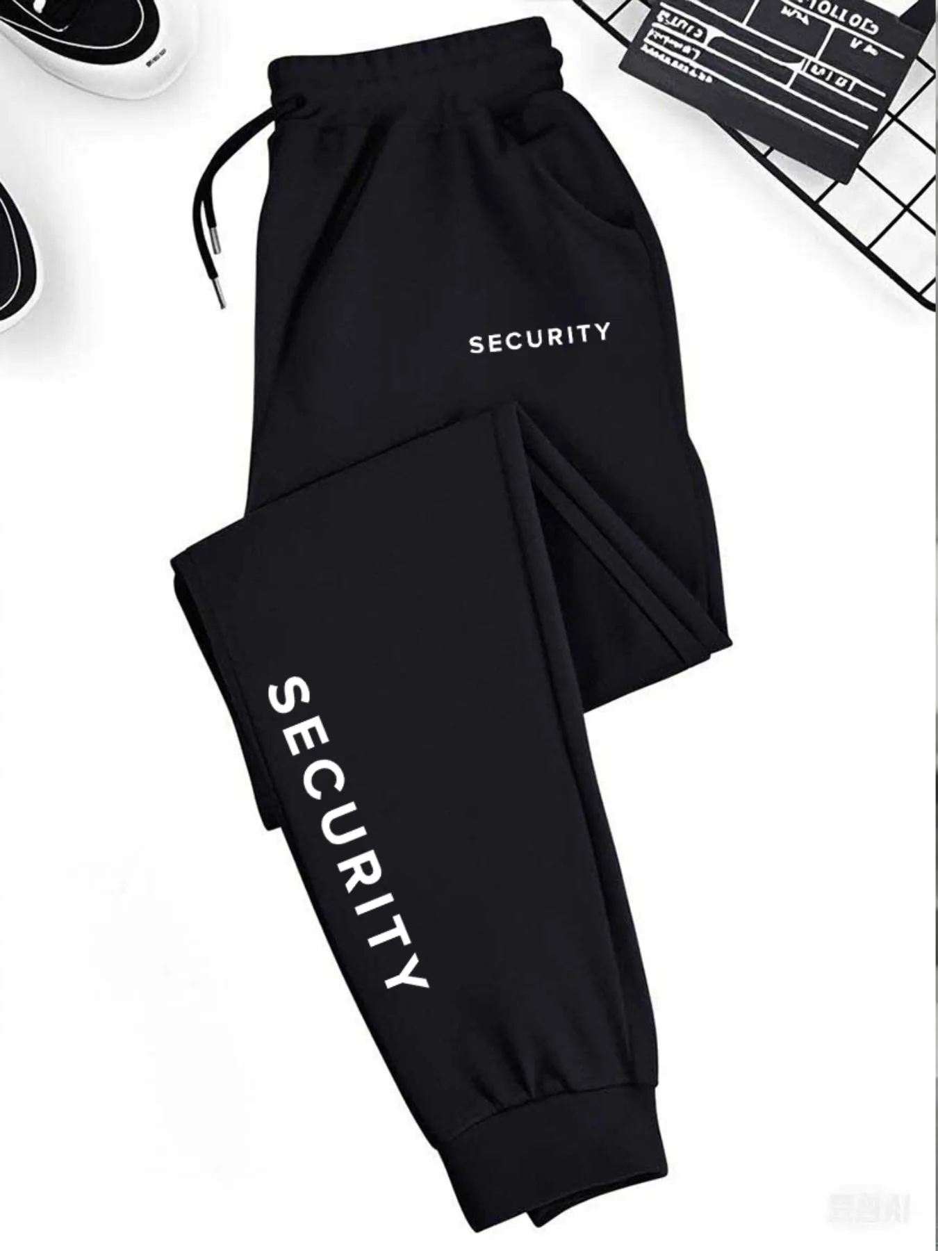1 pair of men's casualsportpantswithdrawstring featuringtheletter
