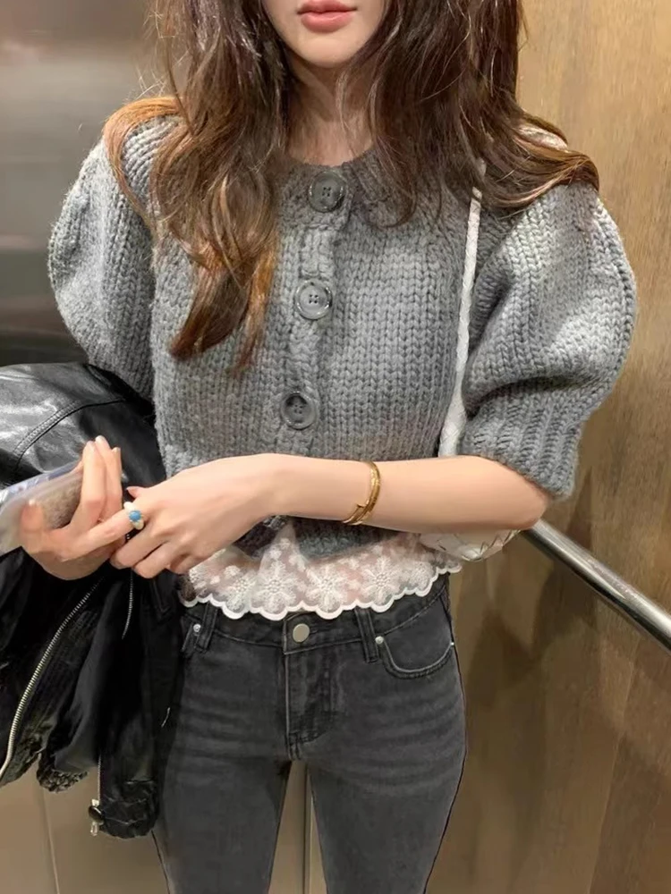 ソフトショートバブルスリーブニットセーター女性の春夏の新スタイルシングルボタンエレガントなオープンカーディガントップ