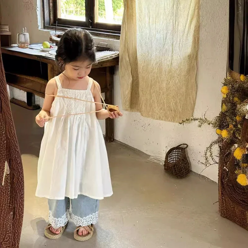 Ropa para niños, vestido Halter holgado dulce a la moda de encaje, novedad de verano 2025, vestido Halter sencillo en blanco y negro para niñas de estilo coreano