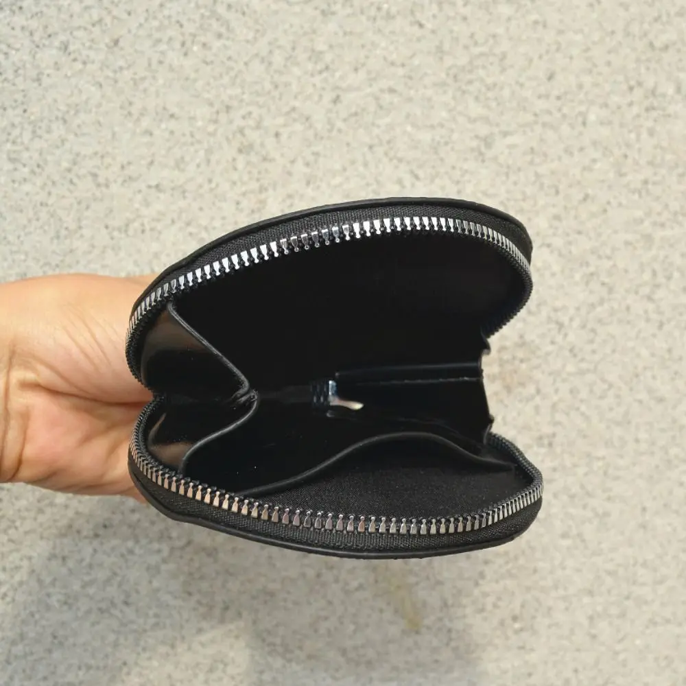 PU-Leder Runde Münzbörse Geprägtes Muster Runde Form Reißverschluss-Münzbeutel Kordelzug-Reißverschluss Kleine Münzgeldbörse – Detail 2