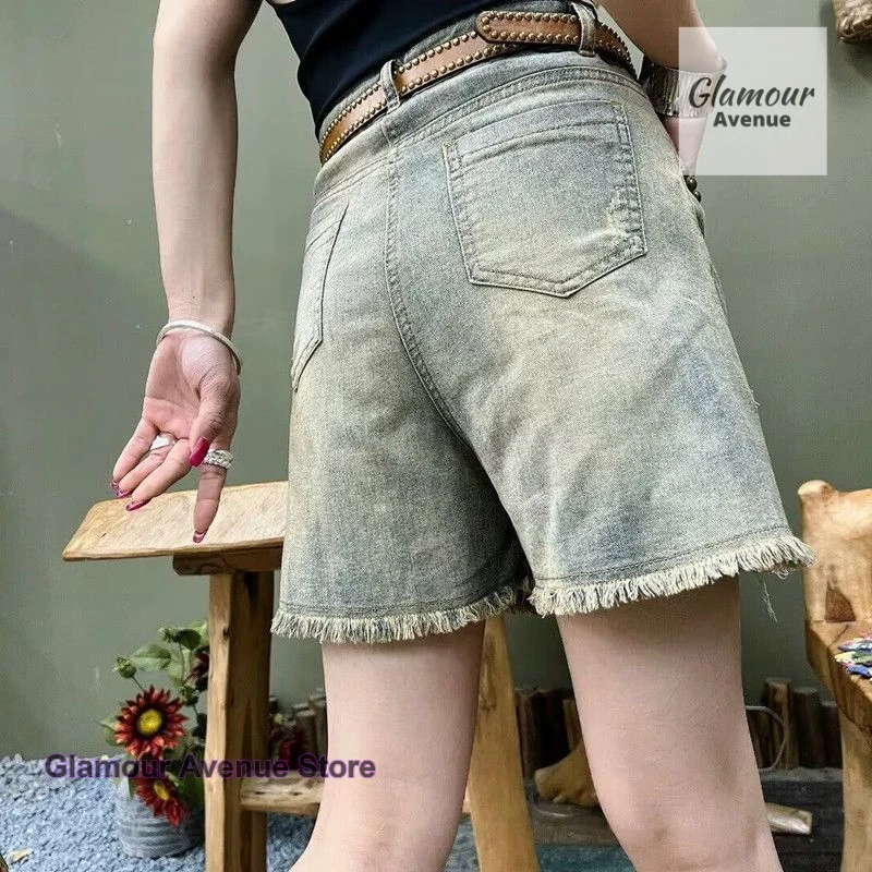 French retro heavy rivet denim shorts women's new summer fashion temperament loose and slim Joker casual wide-leg pants.