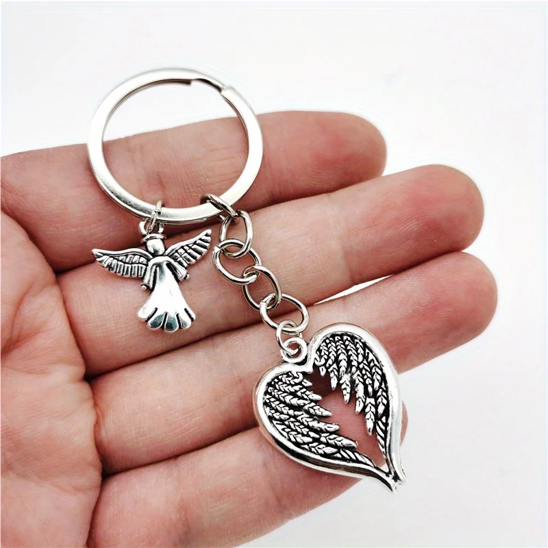 سلسلة مفاتيح Fashion Guardian Angel بتصميم أجنحة على شكل قلب، خفيفة وذكية، يمكن تعليقها على حقائب اليد