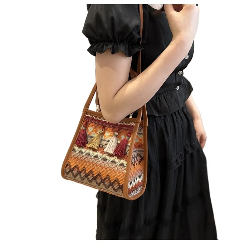 

Senior sense of 2025 new bag female diagonal cross ethnic style niche woven bucket bag shoulder hundred with tassel bags