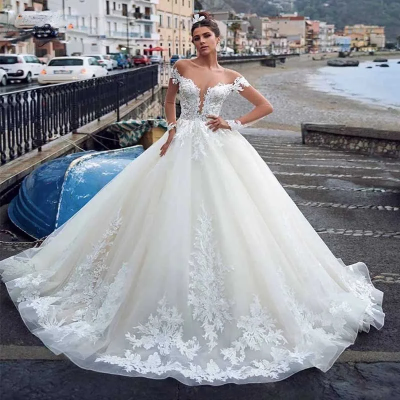 

Graceful Sheer Neck Wedding Dresses Long Sleeves Lace Appliques Tulle Court Train Illusion Button Back Princess Bridal Gown 2023