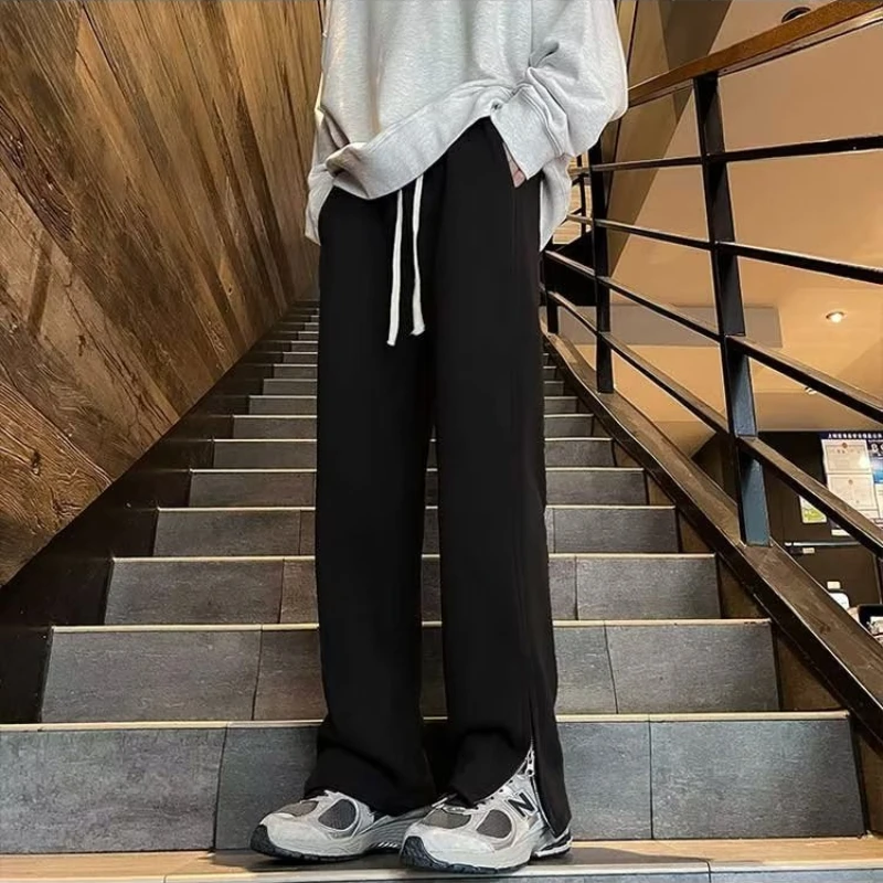 Calça larga masculina estilo japonês solta, fenda lateral, streetwear aconchegante para musculação, chique para adolescentes, monocromática, primavera, verão