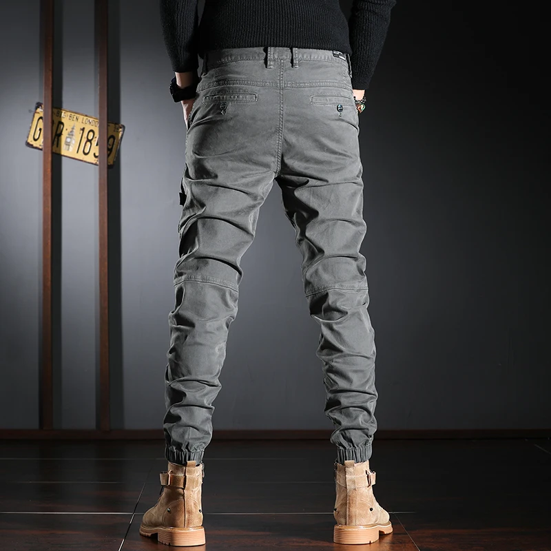 Calças de brim dos homens da moda de streetwear elástico estiramento fino ajuste emendado designer casual carga calças hombre hip hop corredores