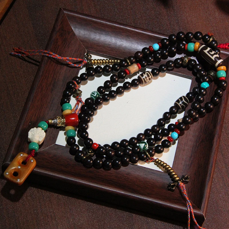 Ebony 108- Buddhist pendant with a Pekkopie ,-pattern , and Fortune God Dzi bead, multi-loop hand-held