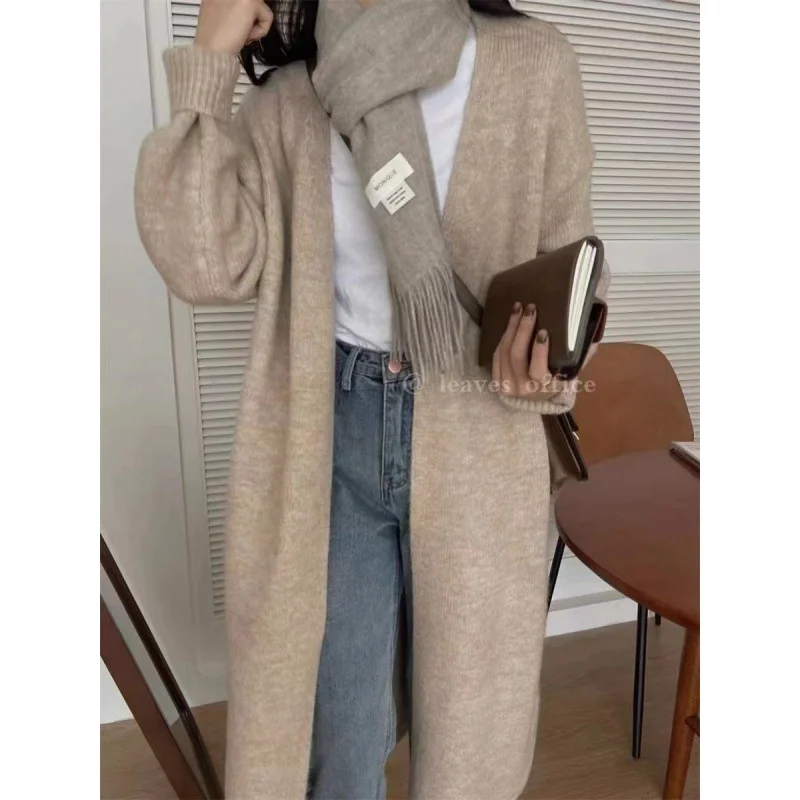 

Женские удлиненные кардиганы: элегантные летние модели с ажурным узором, минималистичные, свободного кроя, геометрические, в стиле «дофамин», с защитой от катышков, пушистые, с оборками, винтажные