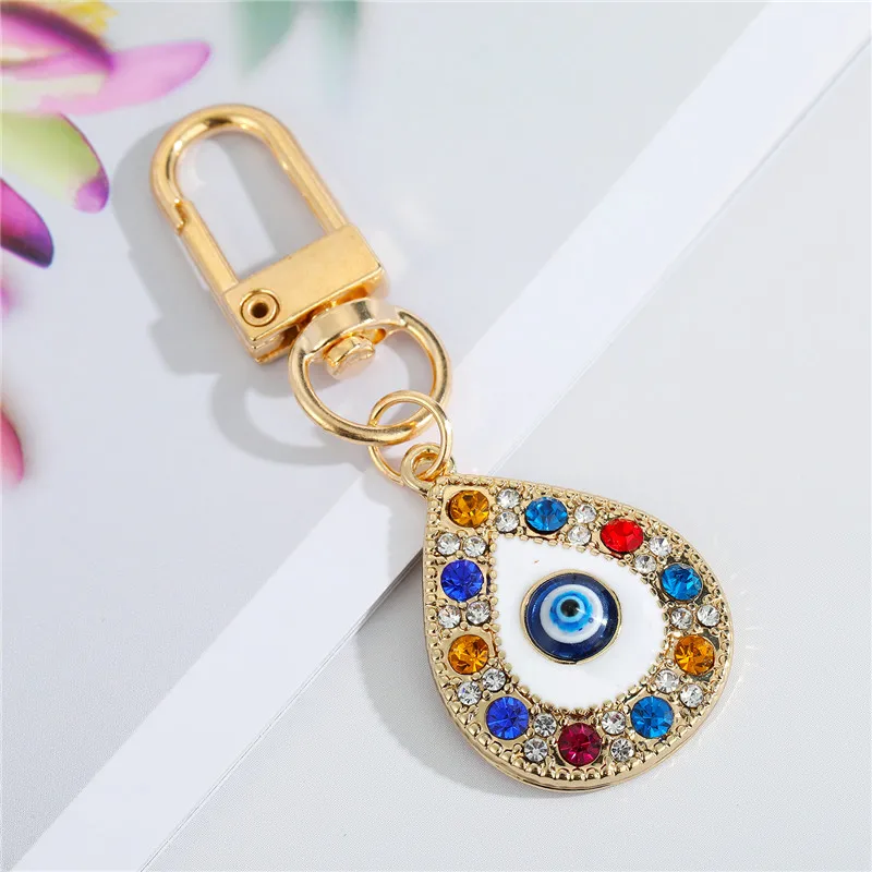 Image 3: Porte Clef Arc-en-Ciel Mauvais Œil Bleu pour Amis ou Amoureux, Accessoire Maléfique, Main de Fatima, Bling pour Sac, Airpods, Voiture, 1 Pièce