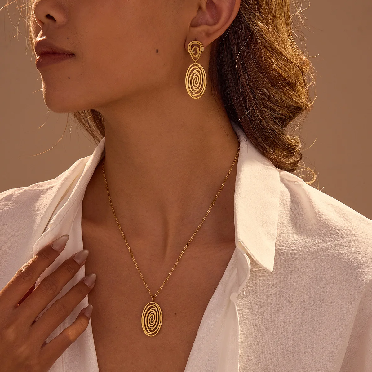 Hollow spiral vortex pendant necklace stainless steel earrings plated 18K gold jewelry set direct sales