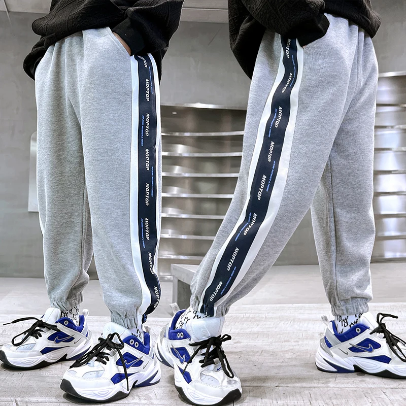 

2023 New boys' autumn casual pants Korean version of thickened pants letter printing trend fashion boy birthday party must.
