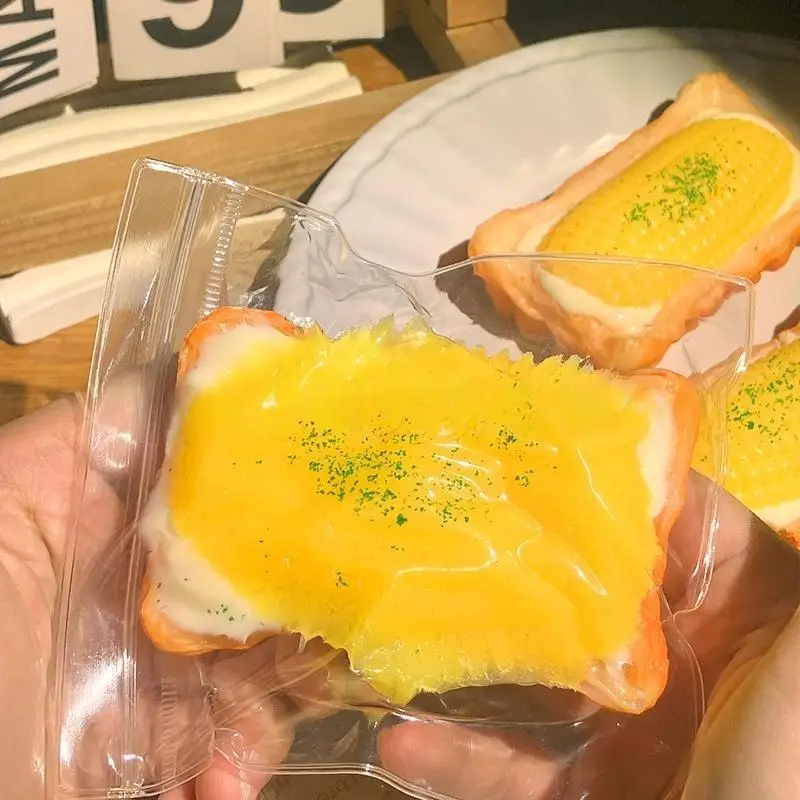 ของเล่นบีบมือทำเองรูปทาร์ตไข่ข้าวโพด 1 ชิ้น เนื้อนุ่มพิเศษ บรรเทาความเครียด ของเล่นบีบยืดหดได้สำหรับเด็ก ของเล่นดนตรีบีบอาหาร