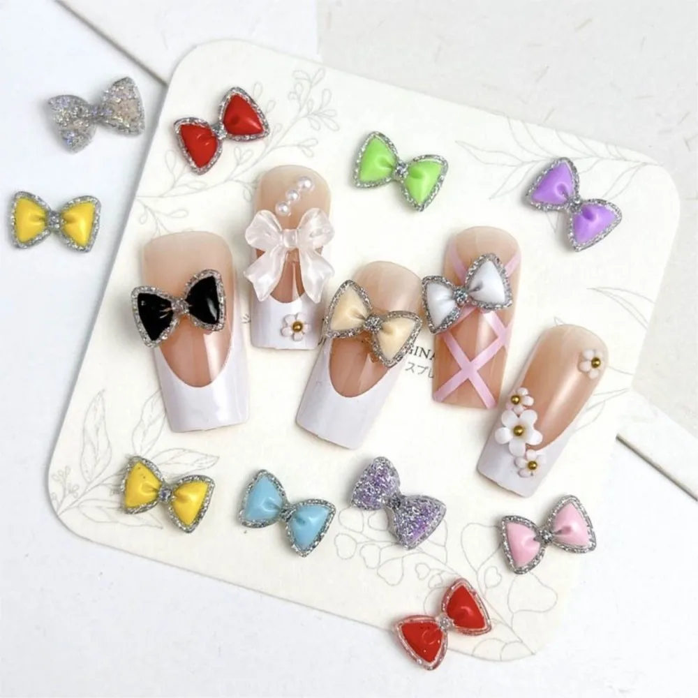50 個発光カラフルなグリッターちょう結びネイルラインストーンスパークリングボウ樹脂ネイルチャーム 12*7 ミリメートルフラットバックボウタイネイル用品 E3